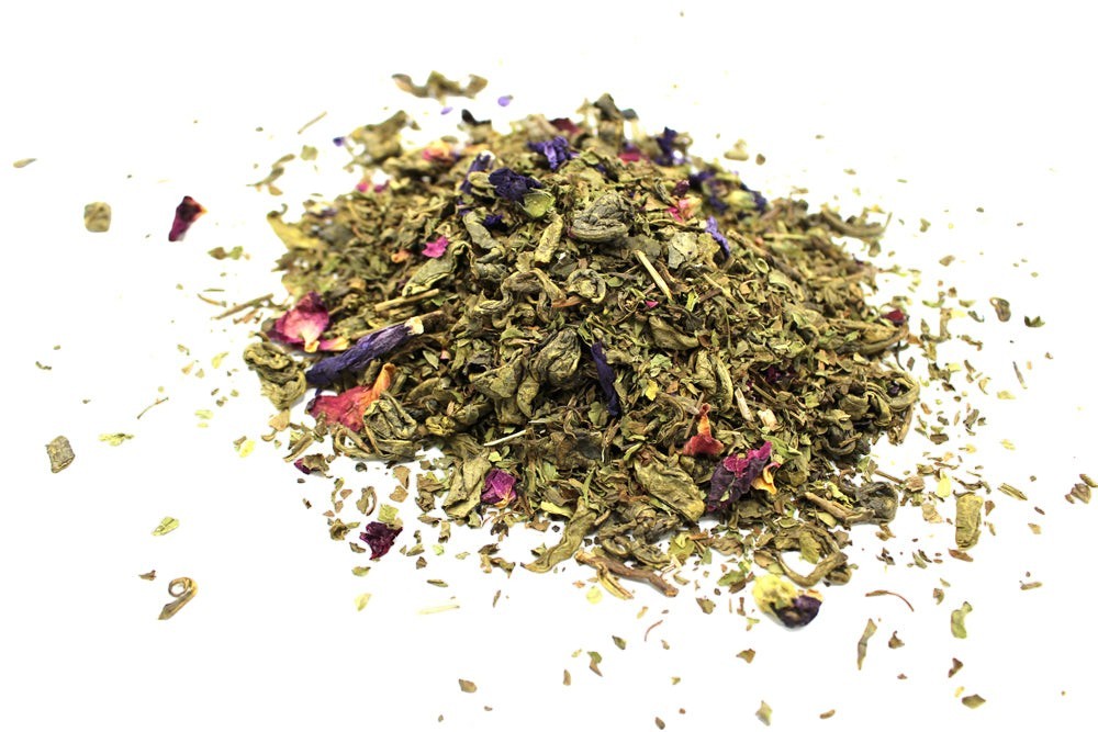 Givva Gifts mindfulness meditation herbal tea blend with dried green leaves, purple petals, and pink floral botanicals.