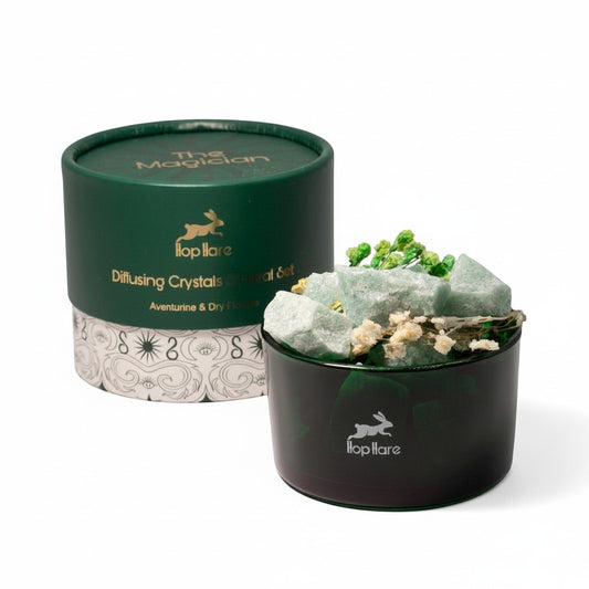 Givva Gifts The Magician diffuser set with green aventurine crystals and dried flowers in a dark green glass jar.